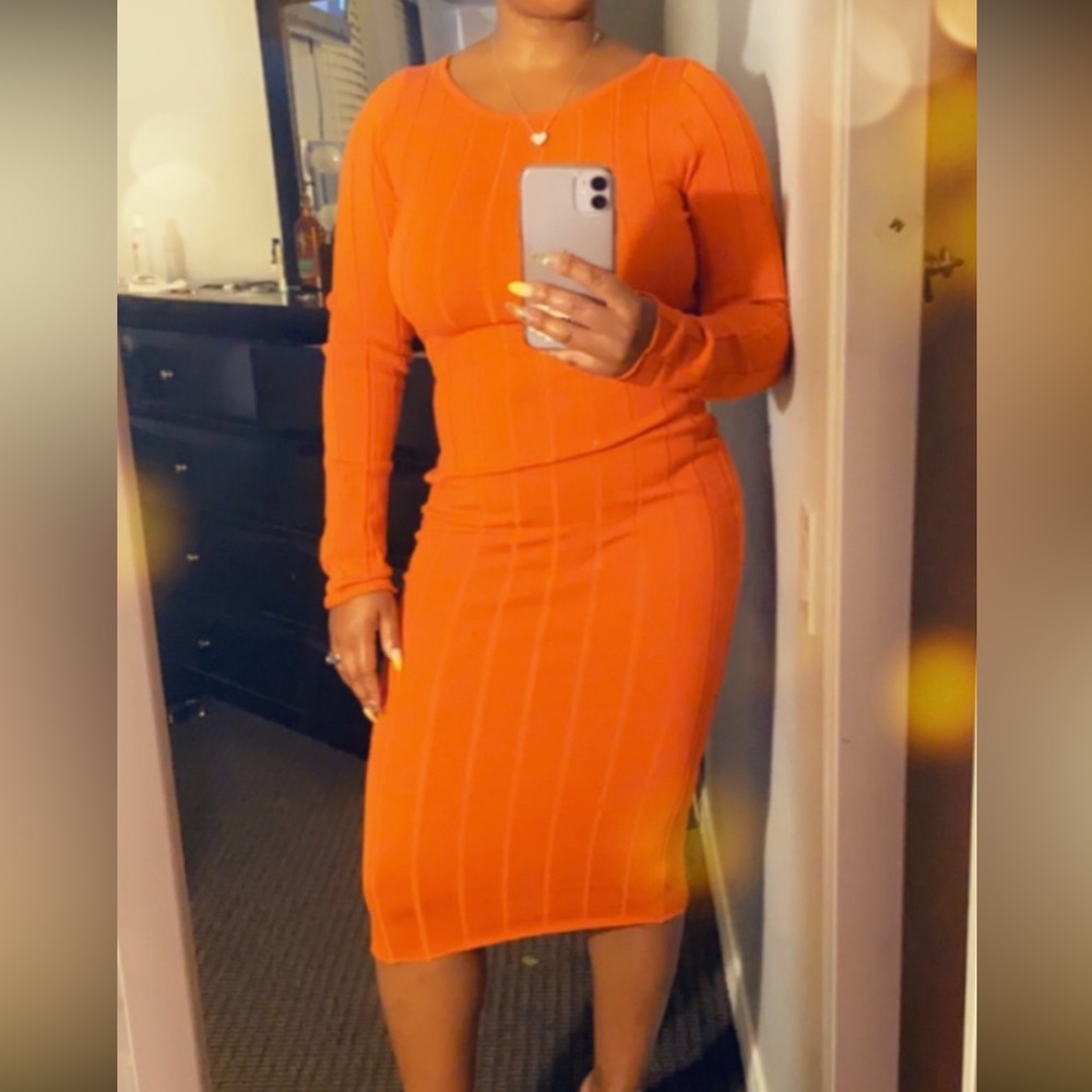 Vibrate Orange dress fits the like a glove.